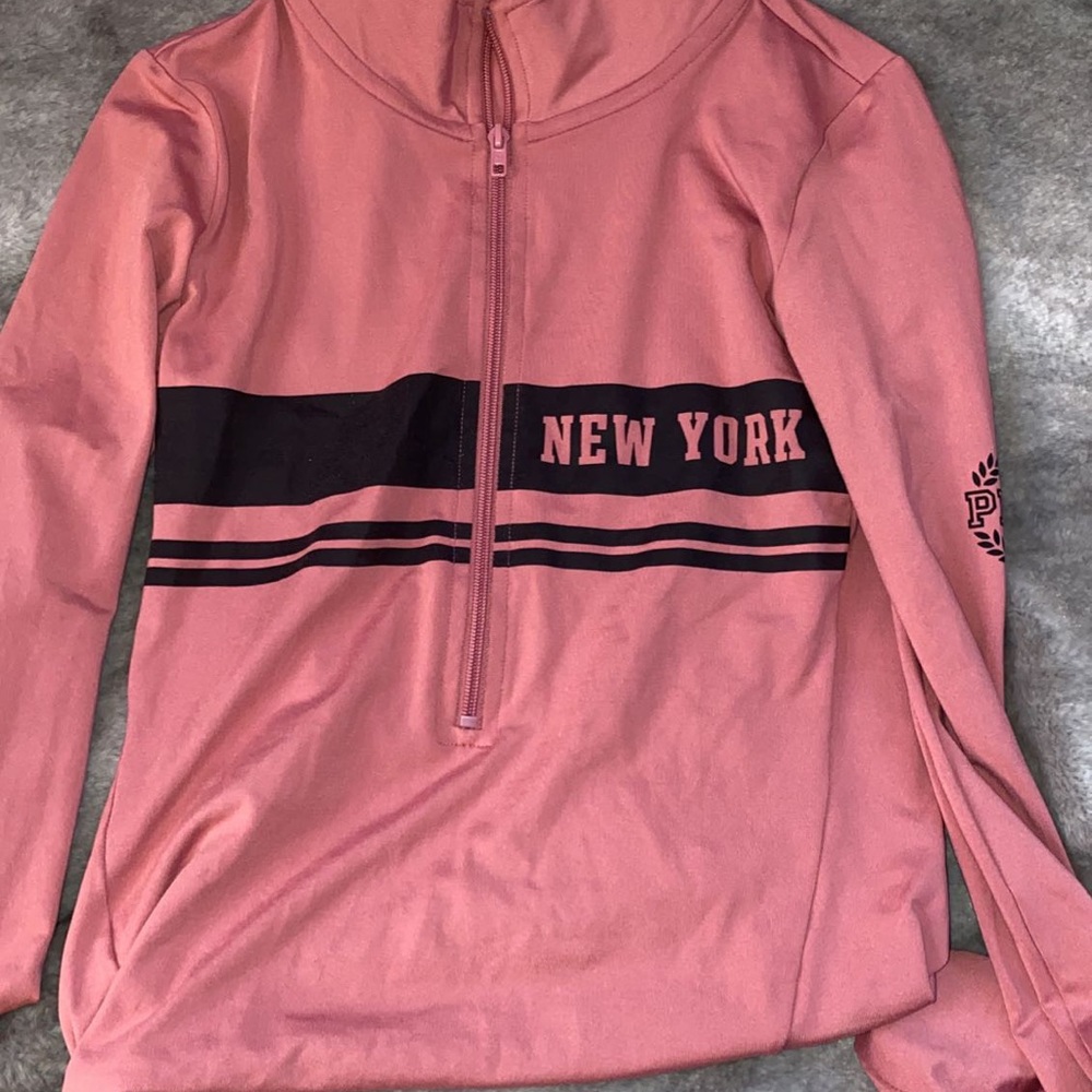 88% Polyester quarter zip.